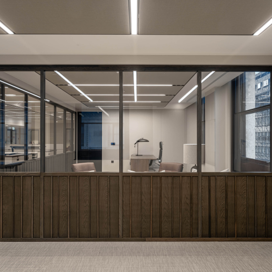 Solid panels add contrast and texture, allowing for greater variety within glazed partitions.