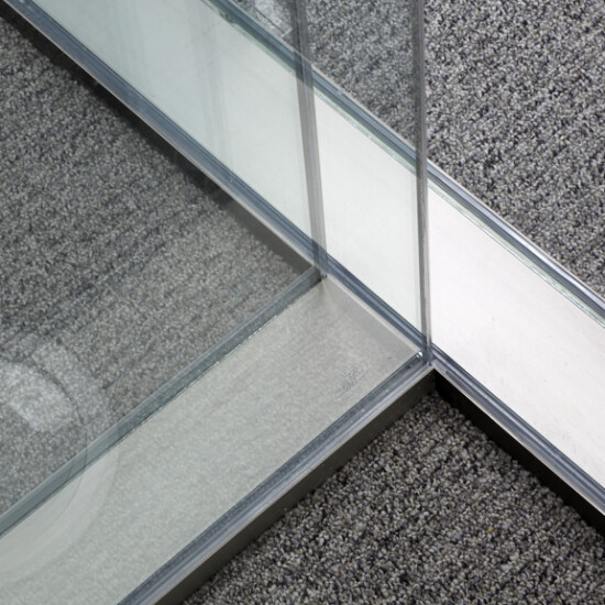 All glass three way junction with no mullions for maximum visual impact.